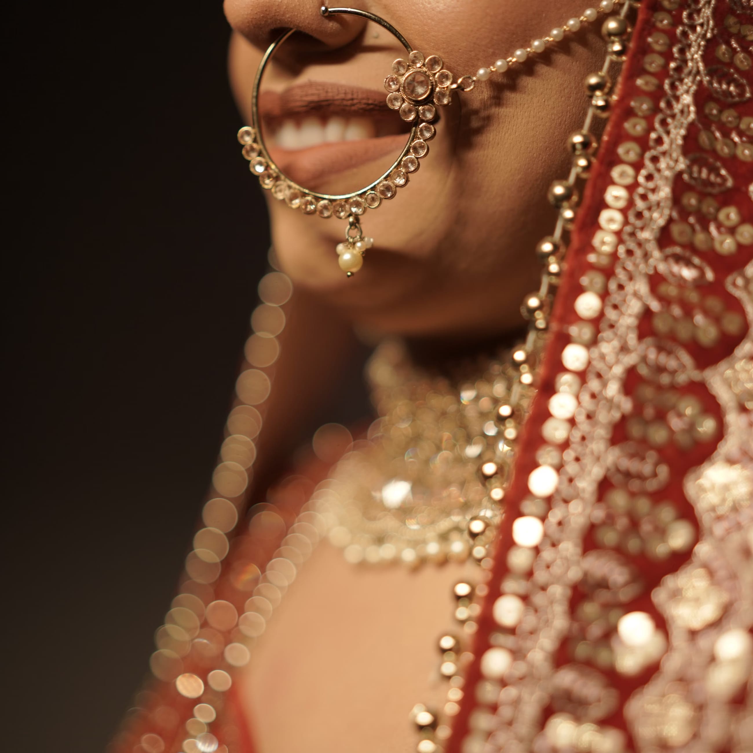 Bride with HD makeup, a low bun and a string of fresh gajra
